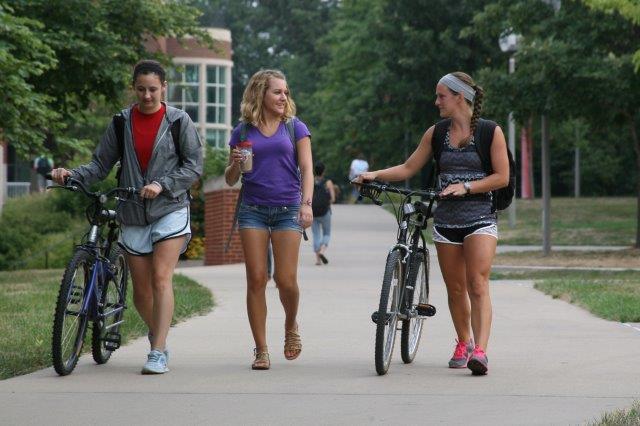 Photograph of people walking and biking along a paved path